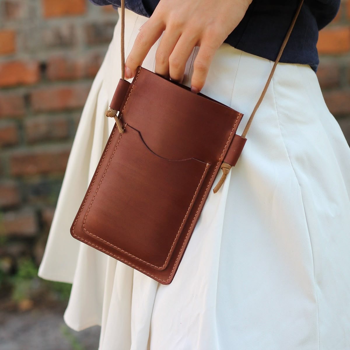 Leather hides stacked on industrial racks in a processing facility